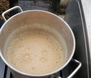Mashing in a brew kettle before hops are added in the boil step